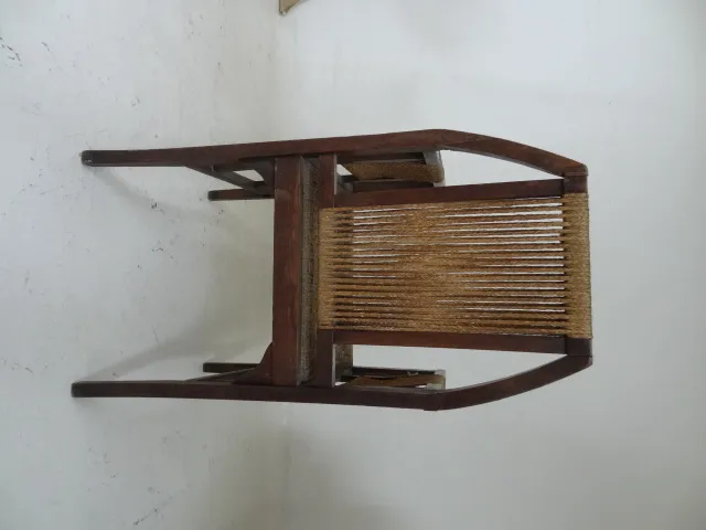 Antique desk chair with wooden structure and woven seats