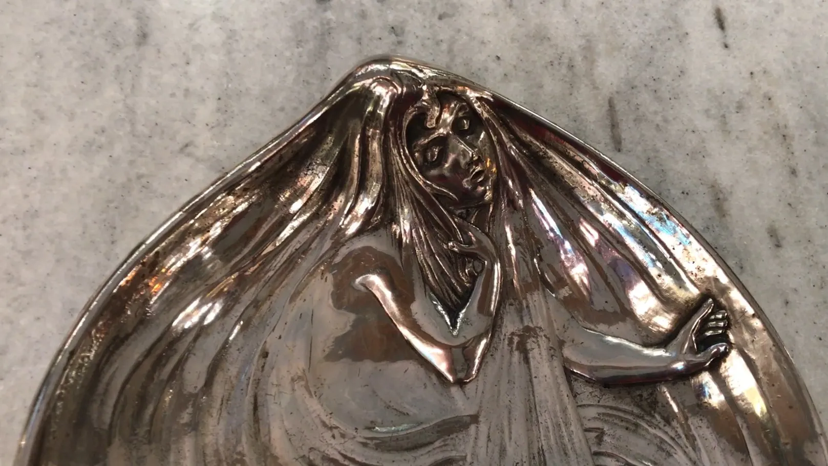 antique WMF card tray featuring a decorative figure