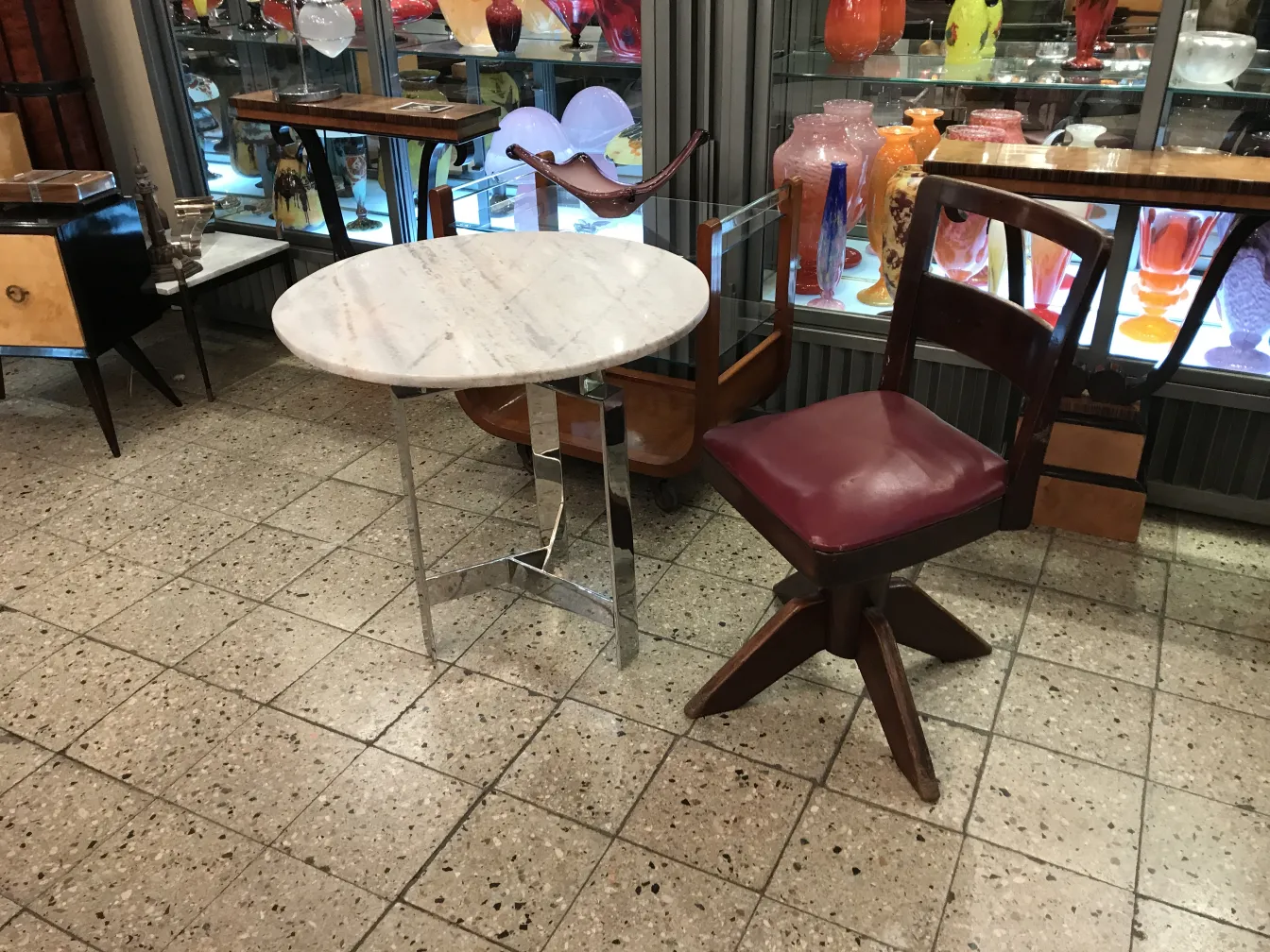Four antique desk chairs with classic design in a charming setting.