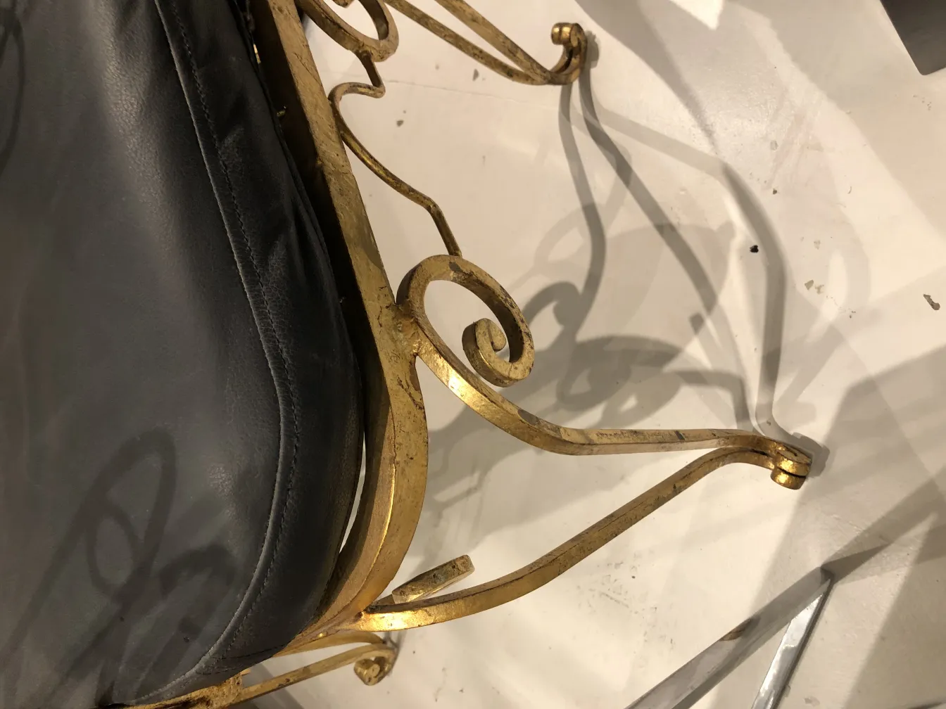 two chairs with an antique decorative design