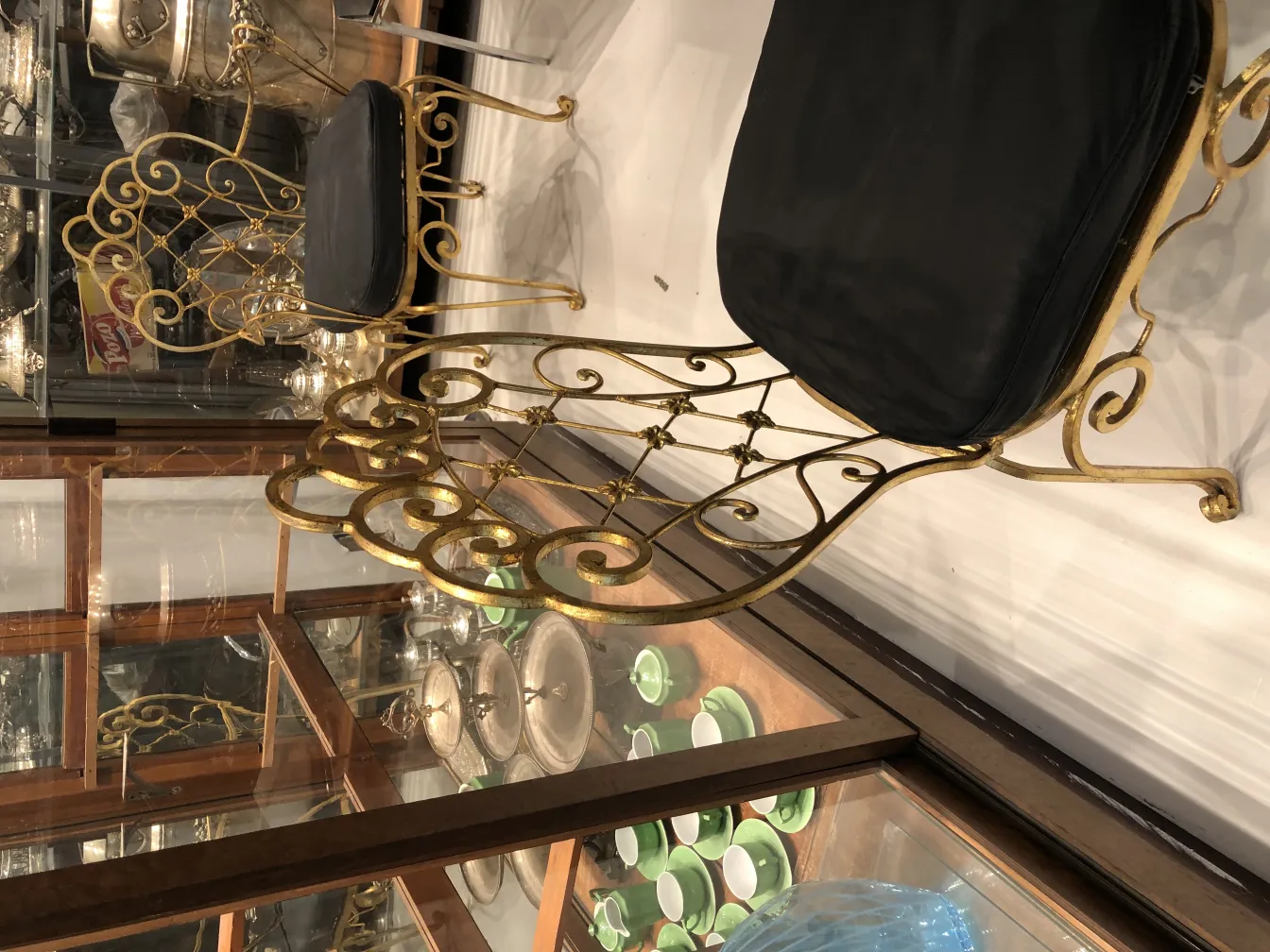 Two antique chairs with decorative design and cushions