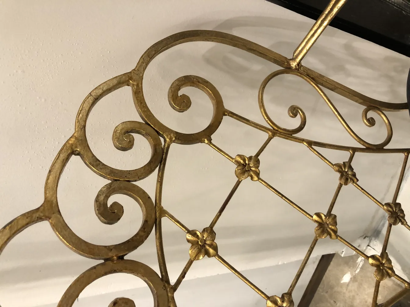 View of 2 antique chairs with decorative detail on the backrest