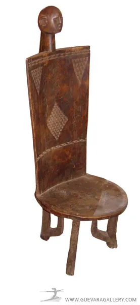Two antique chairs with decorative backrest and facial detail