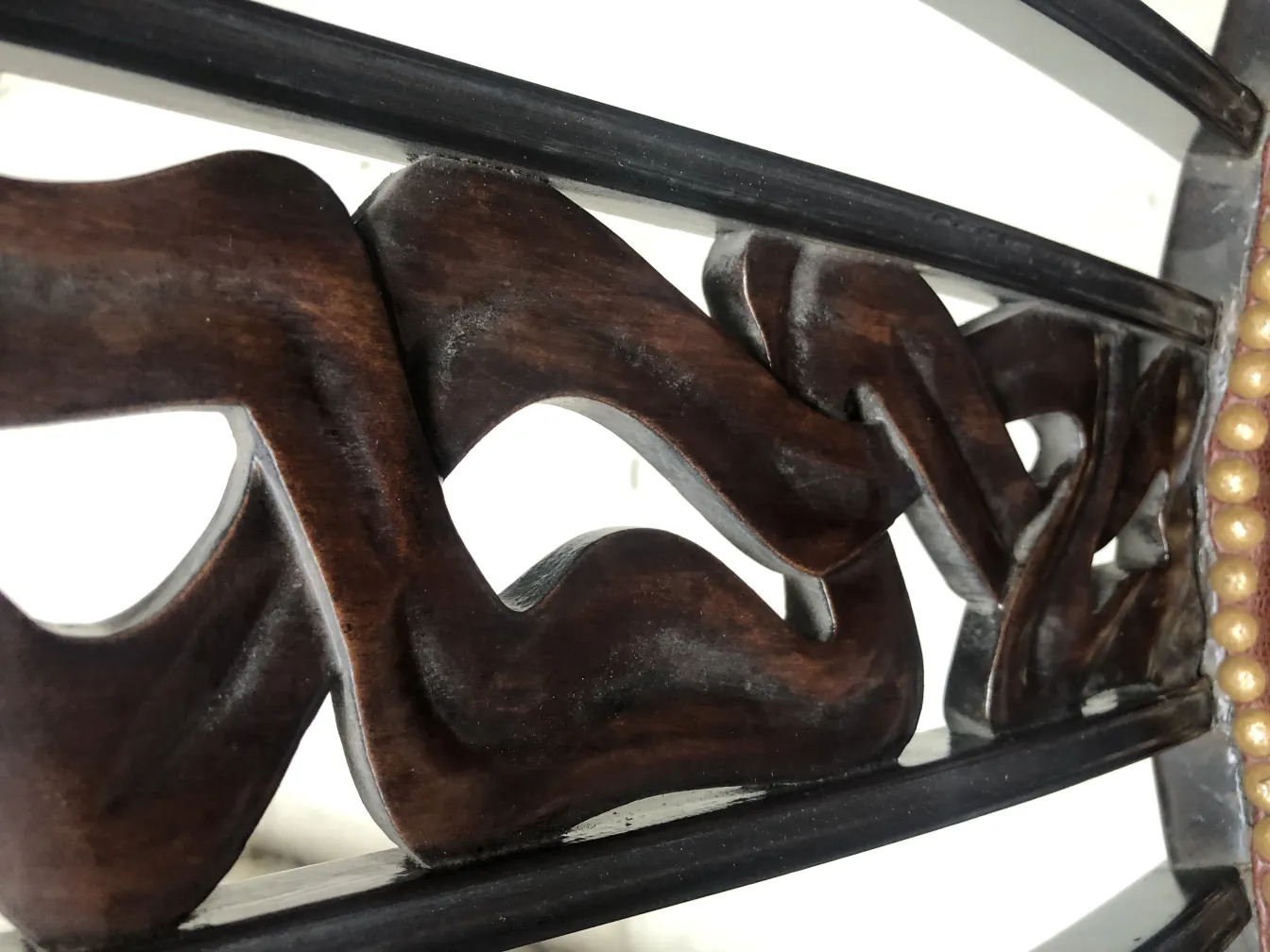 Detailed view of 2 antique chairs with ornaments