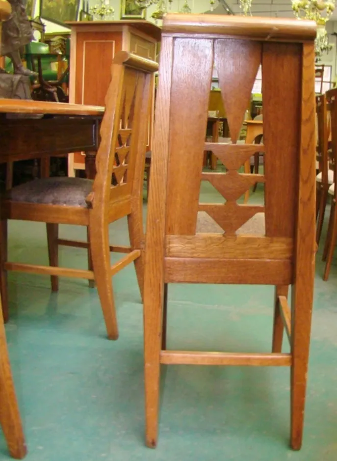 Side view of six antique chairs in a vintage setting