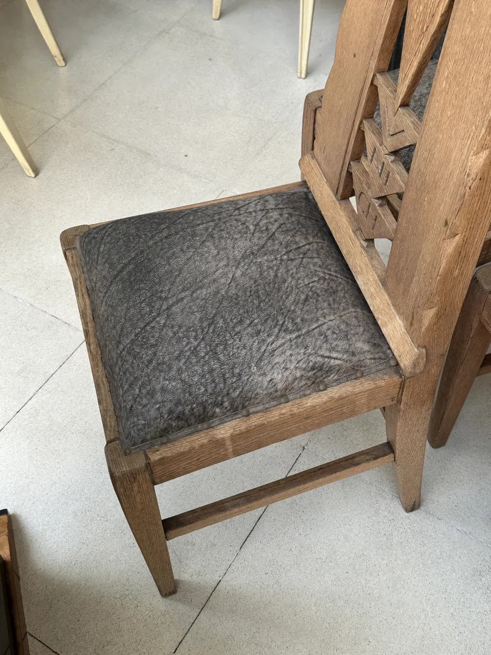 Six antique Munich chairs with distinctive design in a simple setting.