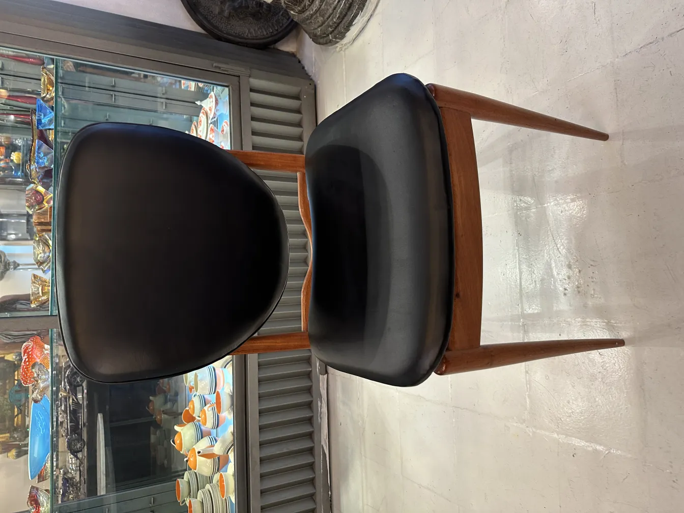 Front view of 8 antique chairs in an elegant setting.