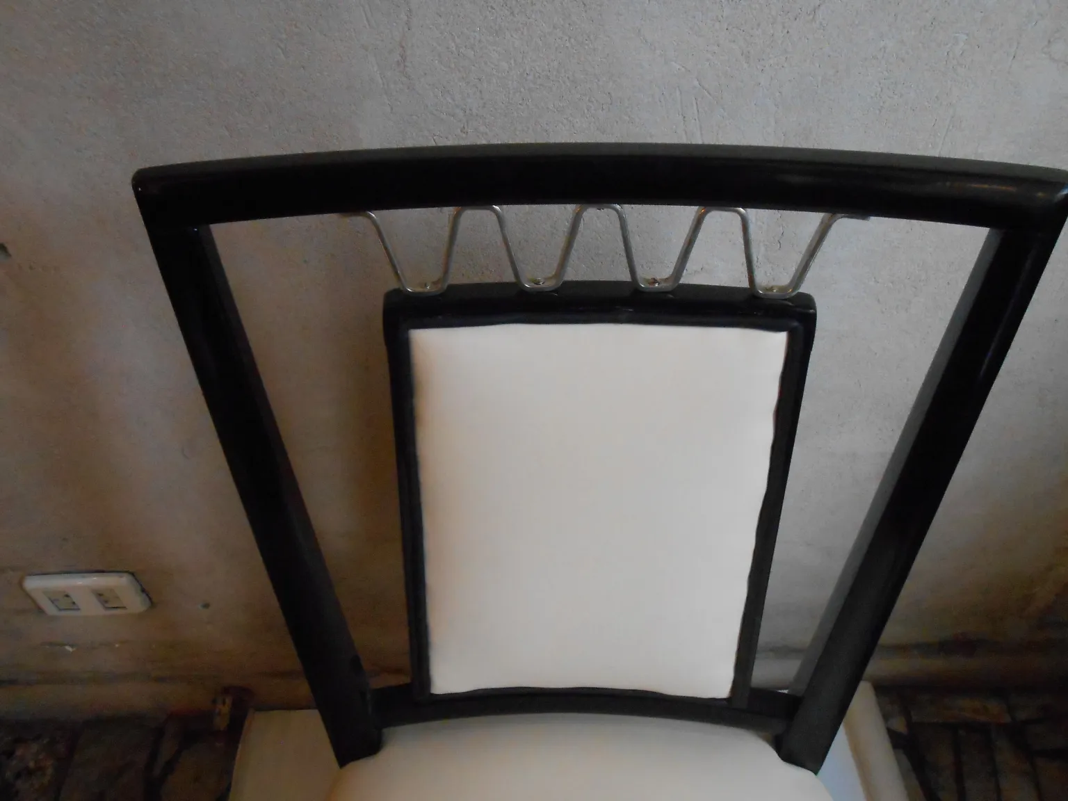 Antique chairs with a white upholstered backrest