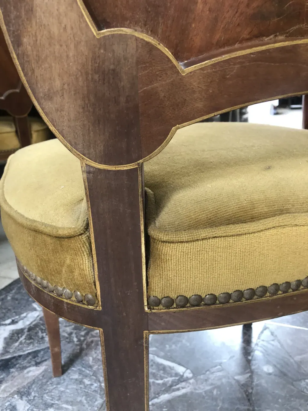 Side view of 12 antique chairs jansen with yellowish cushion