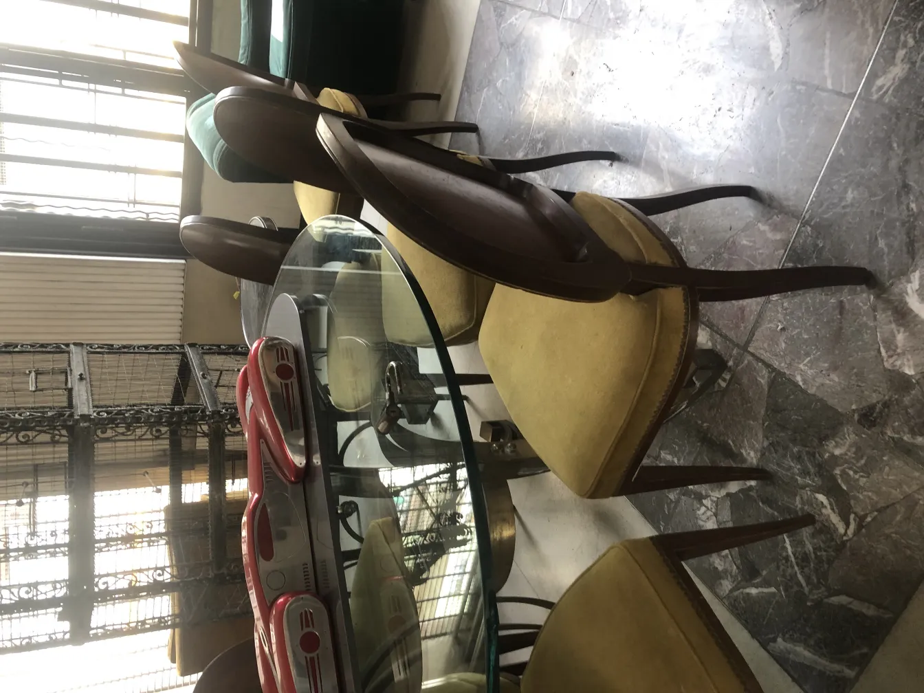 Set of 12 antique chairs in a warm interior setting with details