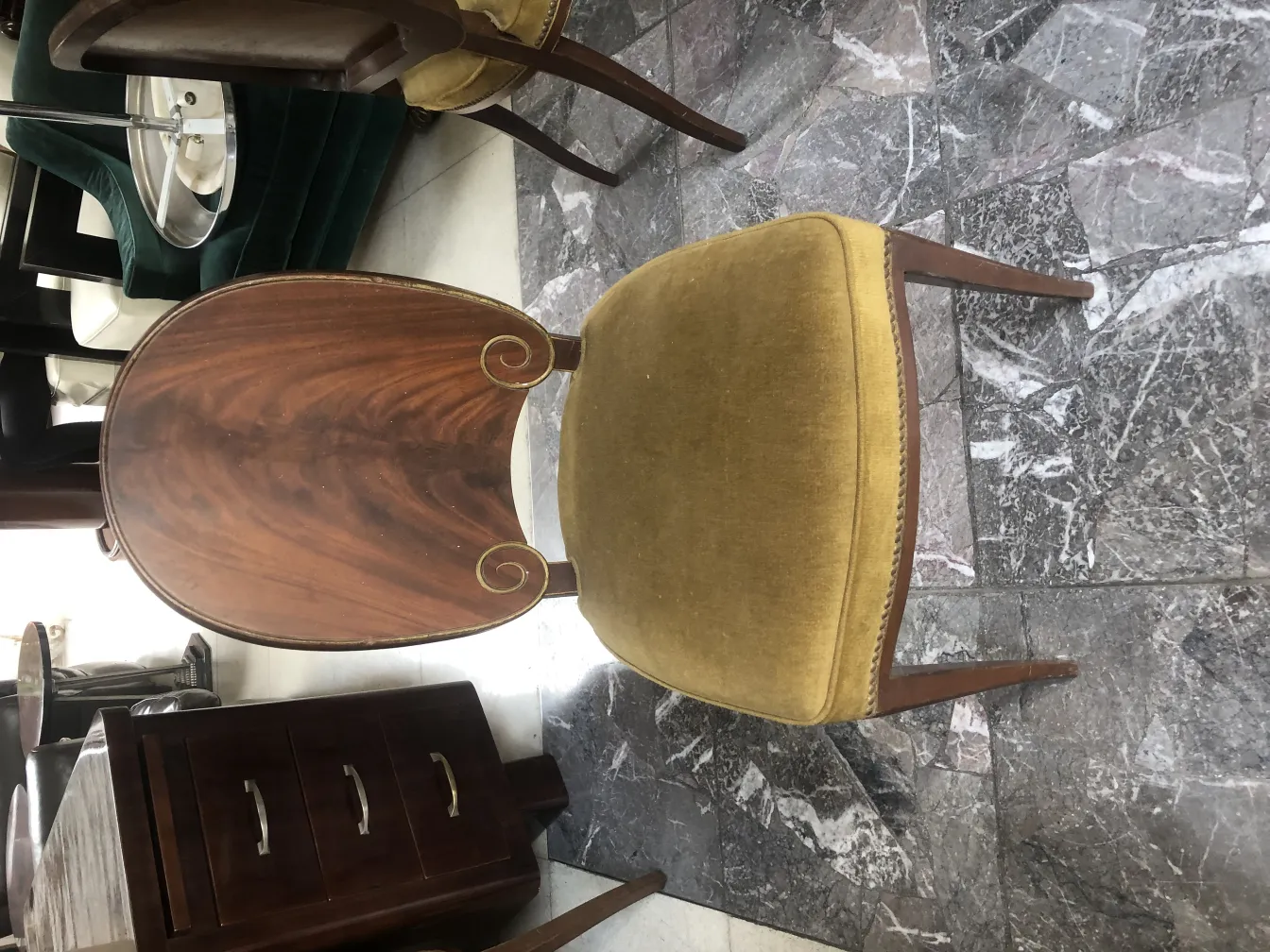 12 antique chairs featuring a curved back design, set in a cozy environment