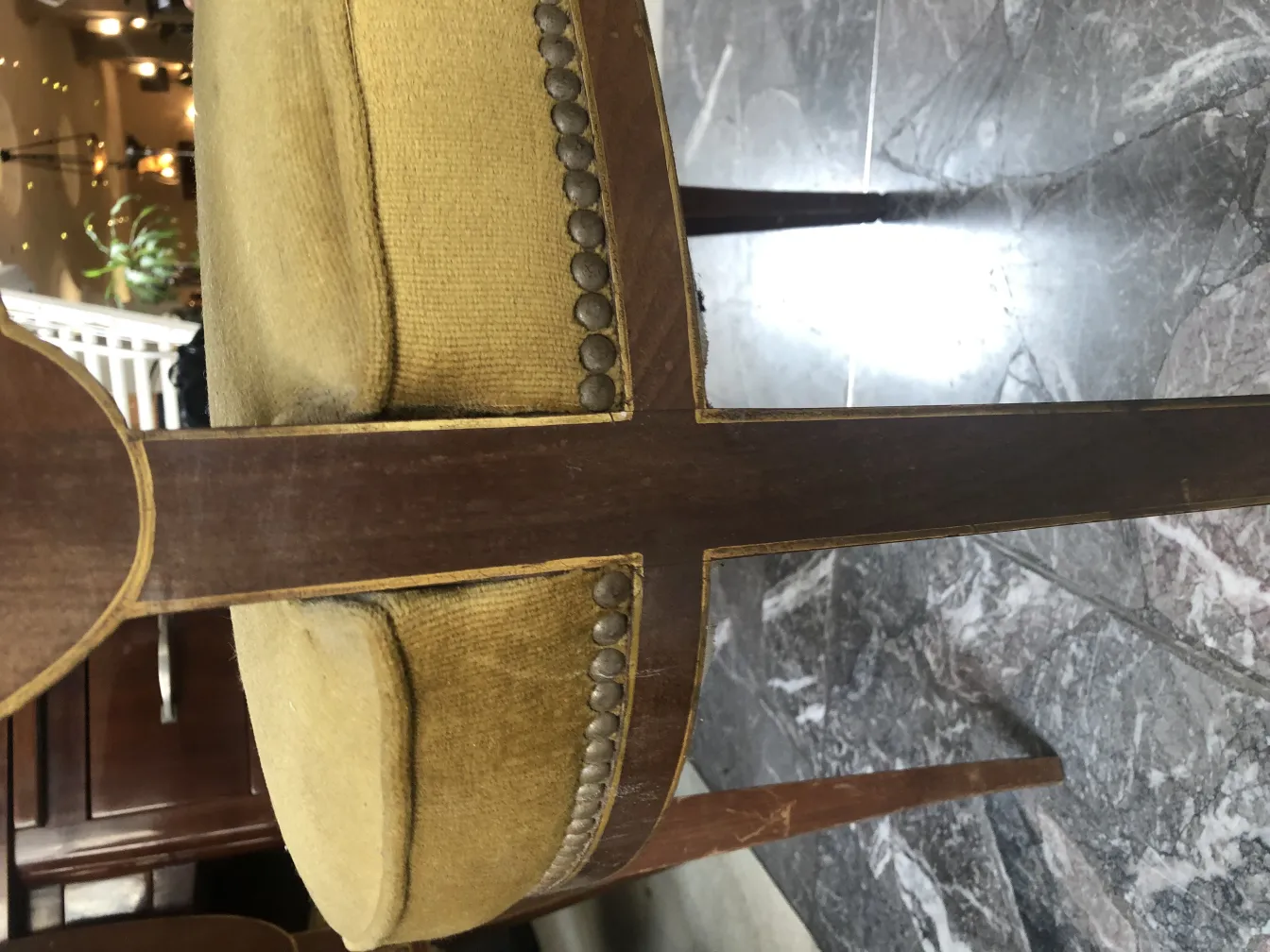 Side view of 12 elegant antique chairs in a cozy setting