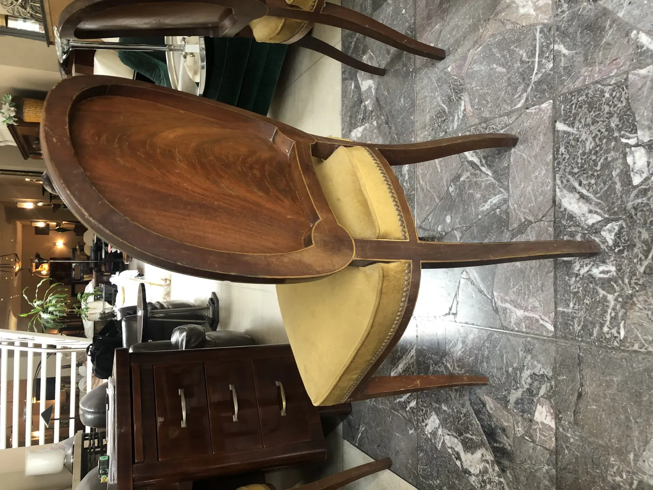 Set of 12 antique chairs featuring elegant details in a cozy environment