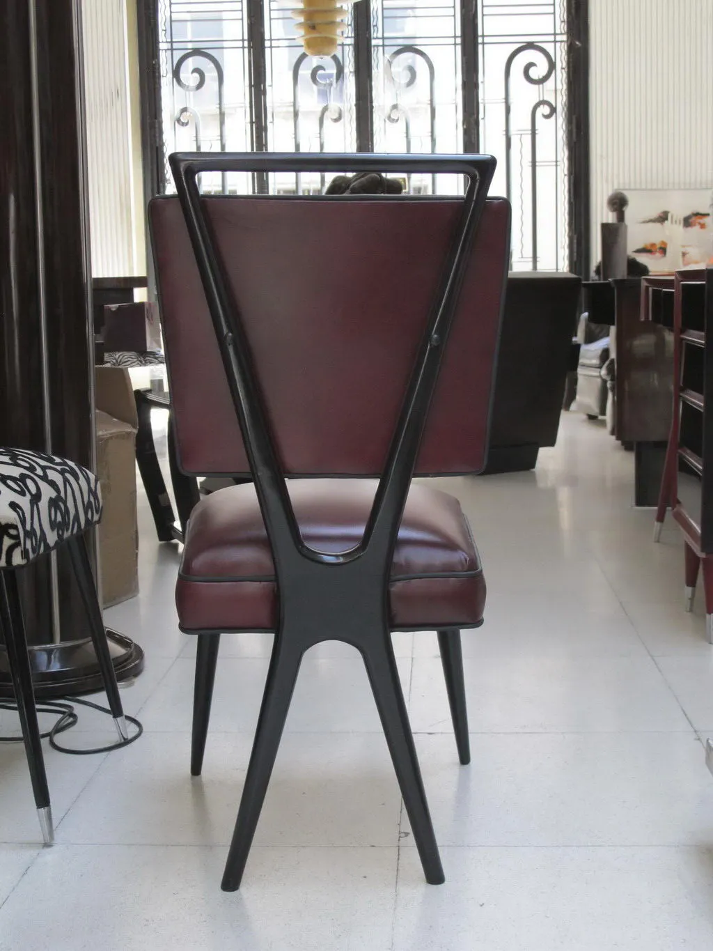 back view of antique chairs with brown cushions