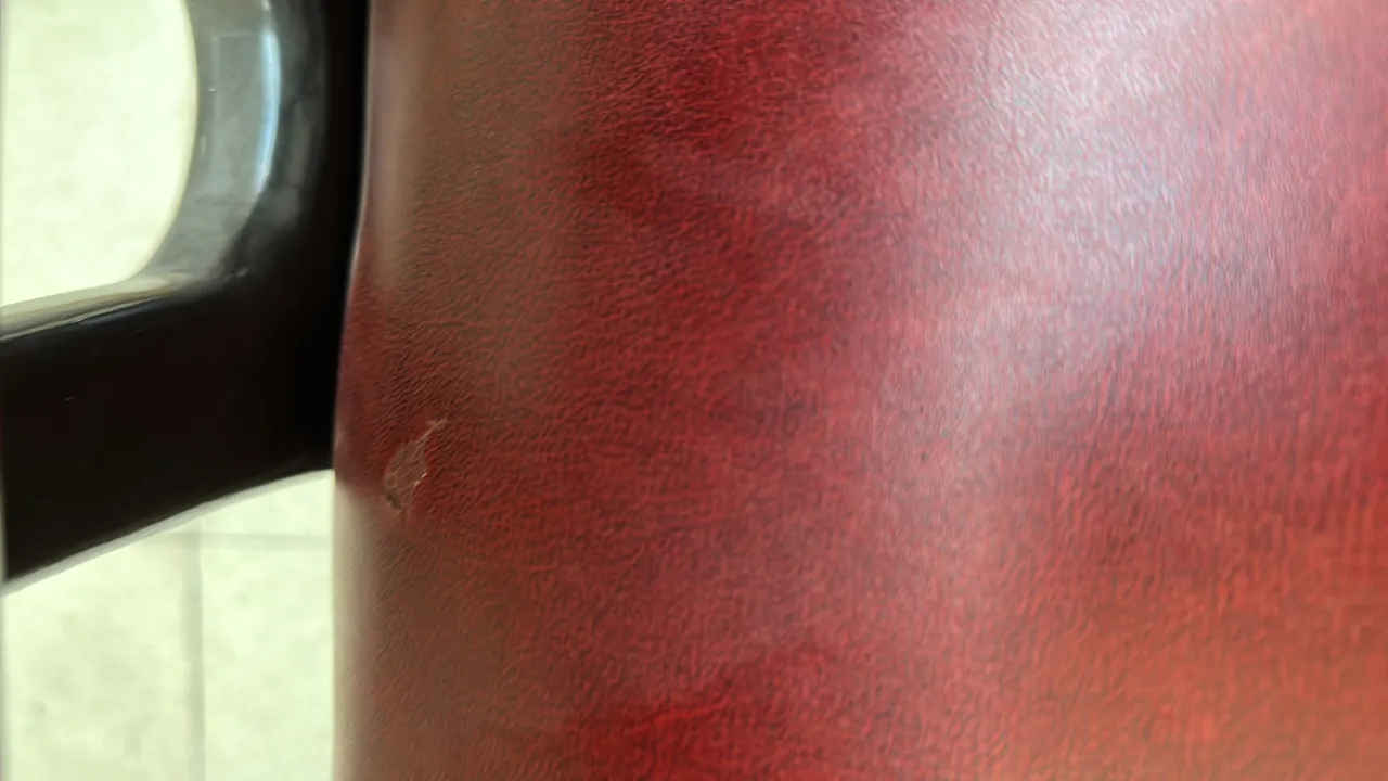 Close-up view of an antique chair with classic details