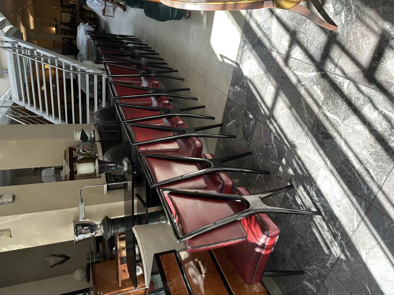 A series of 12 antique chairs in an elegant setting