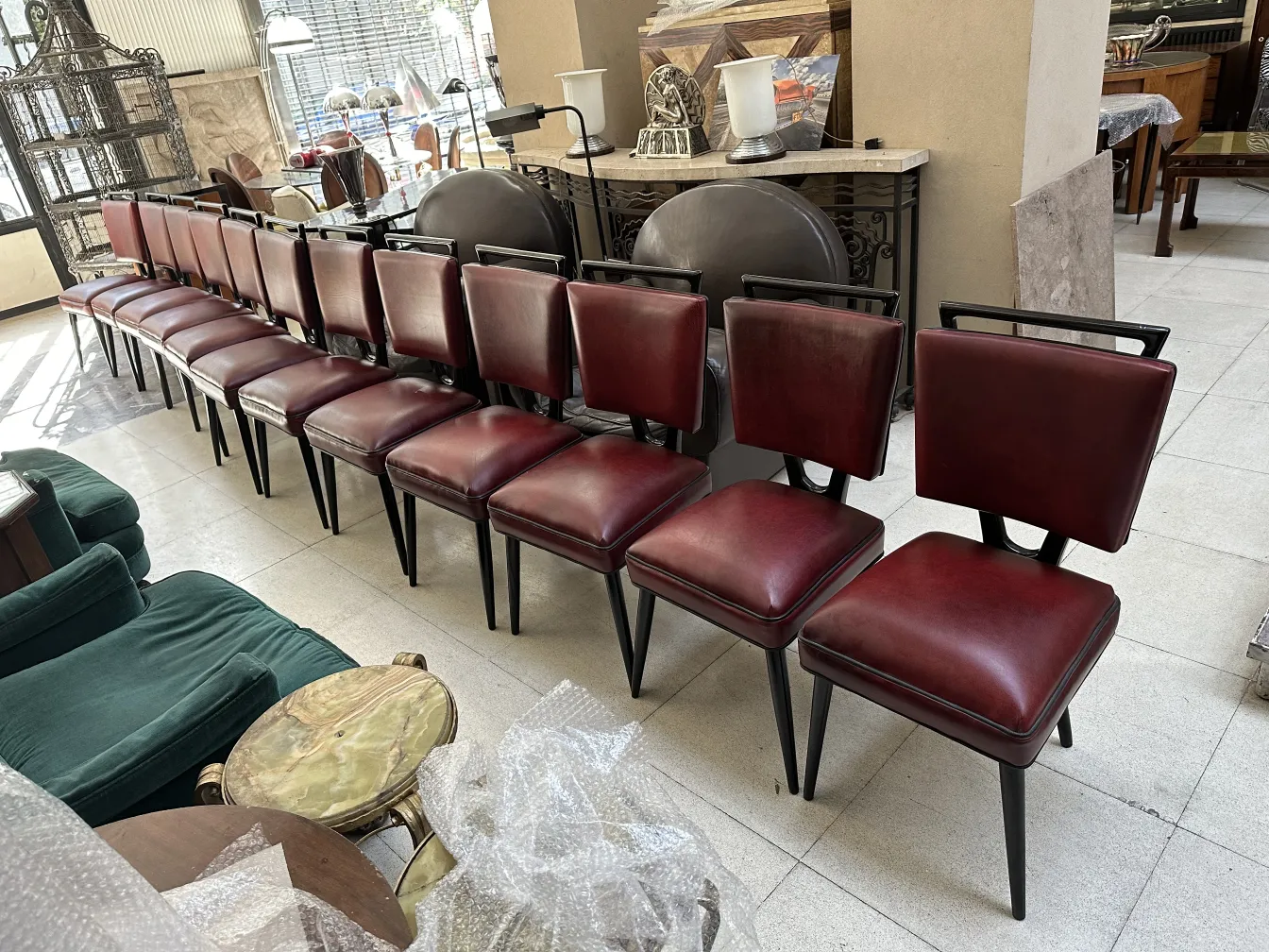 12 antique burgundy chairs lined up in an elegant setting