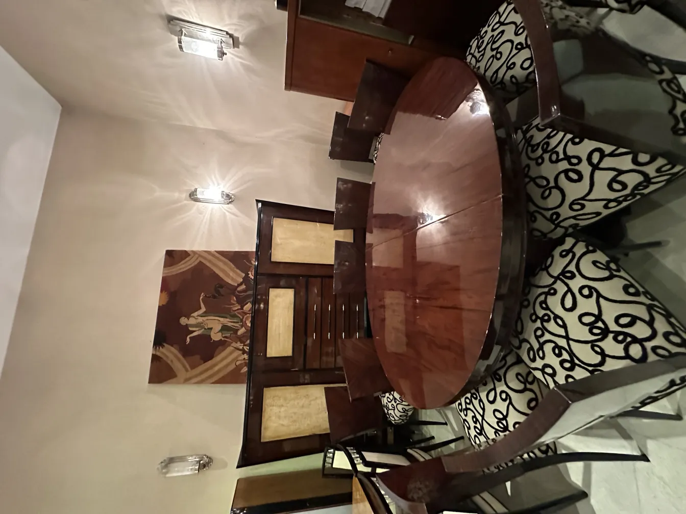 Antique chairs with elegant design and curved legs, surrounded by an appealing setting.