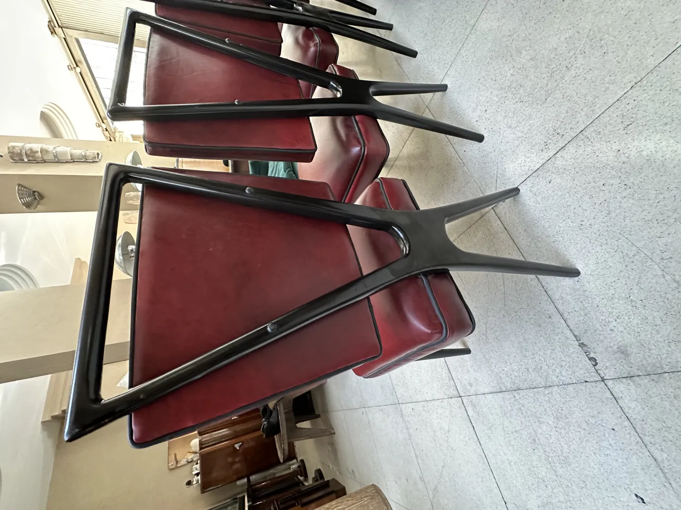 12 red antique chairs with a distinctive design