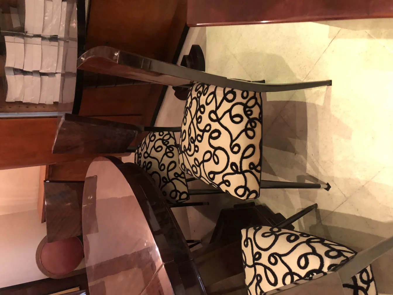 12 antique chairs featuring a distinctive pattern in design.