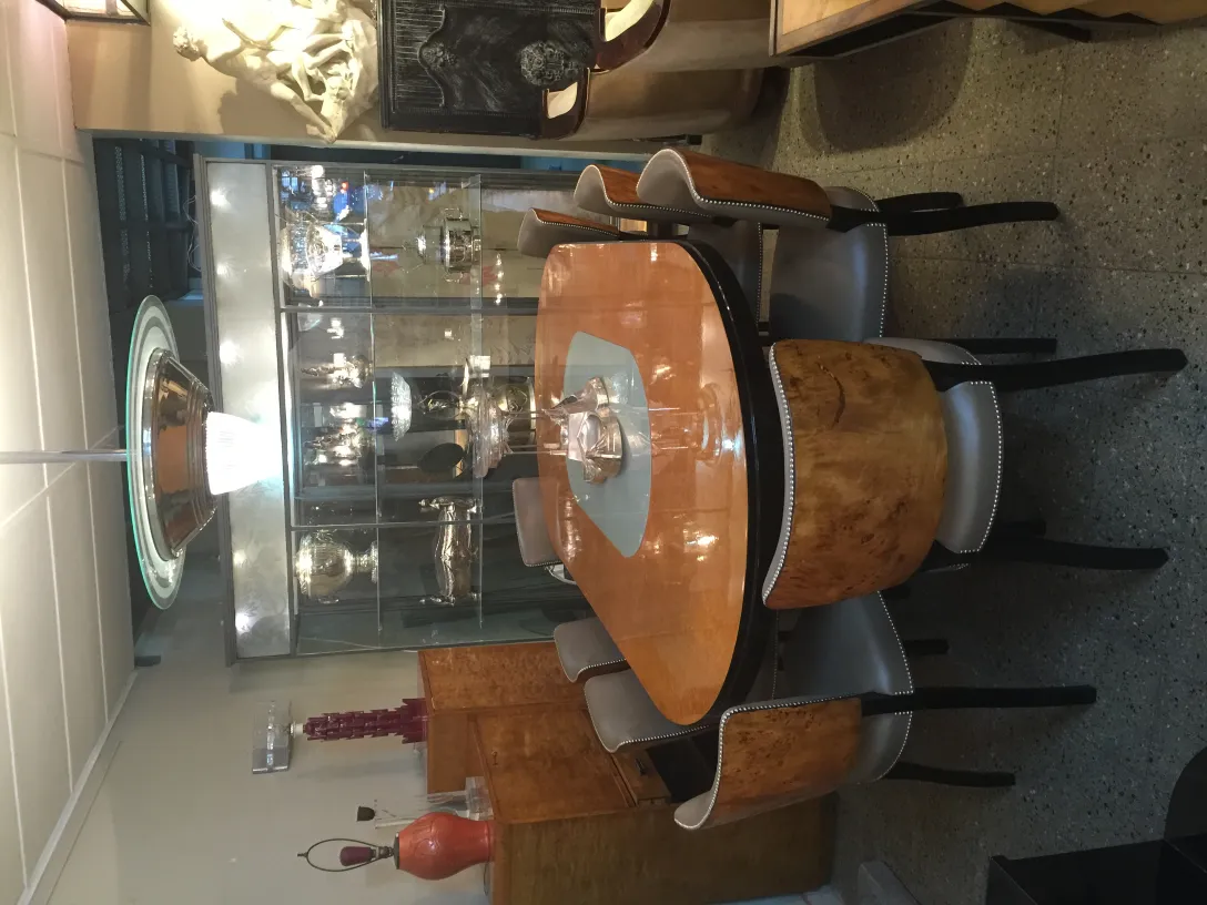 Set of 12 antique chairs around a modern table