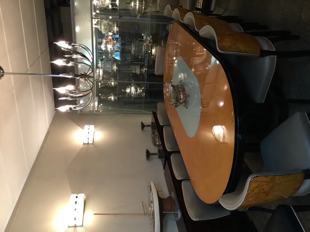 View of 12 antique chairs in a decorative setting