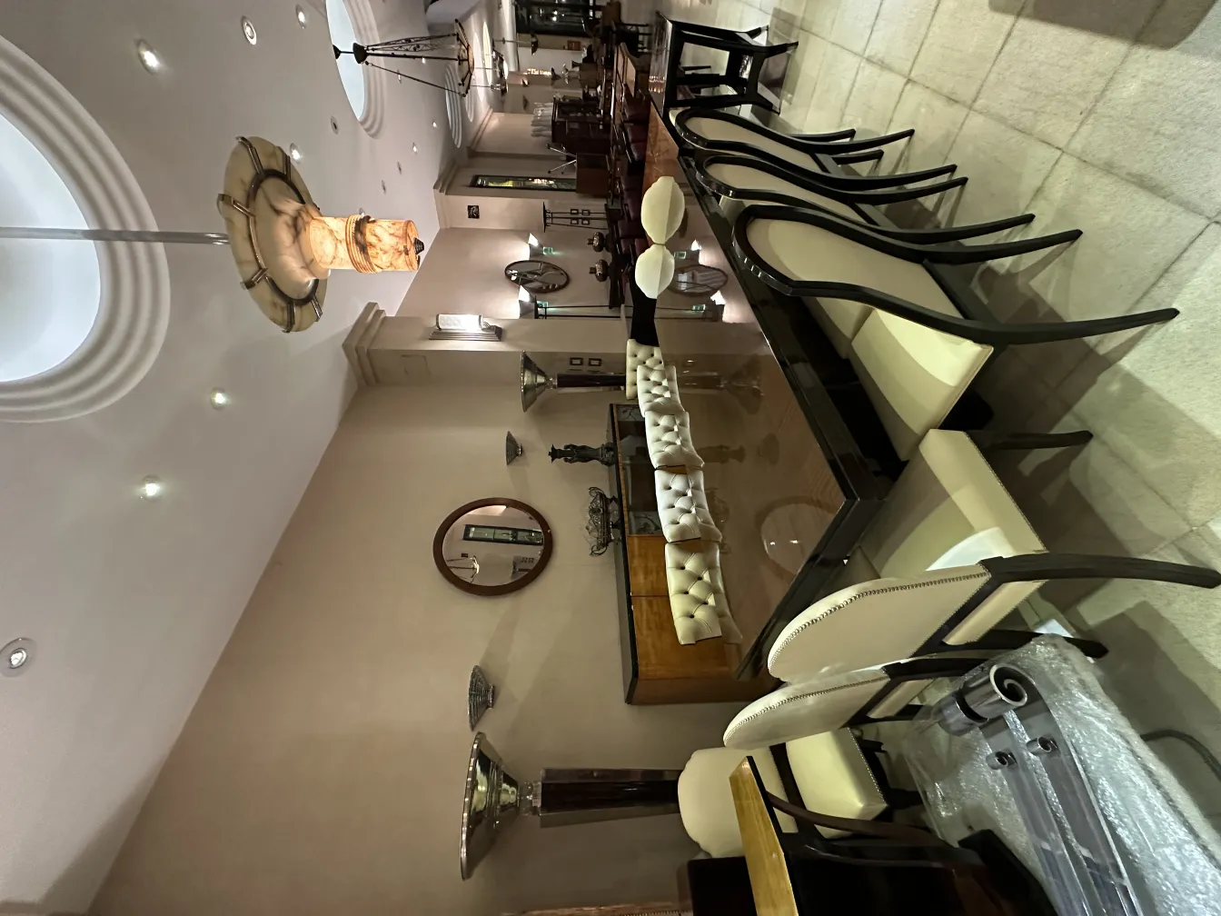 12 antique dining chairs in an elegant setting