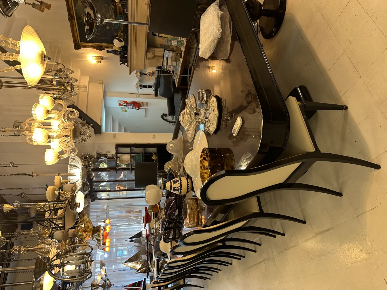 View of 12 antique chairs around an elegant table