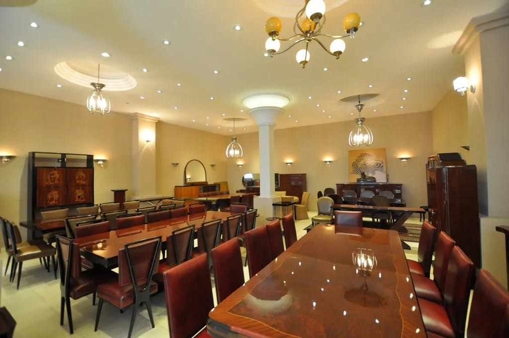 twelve antique chairs with elegant design in a dining room