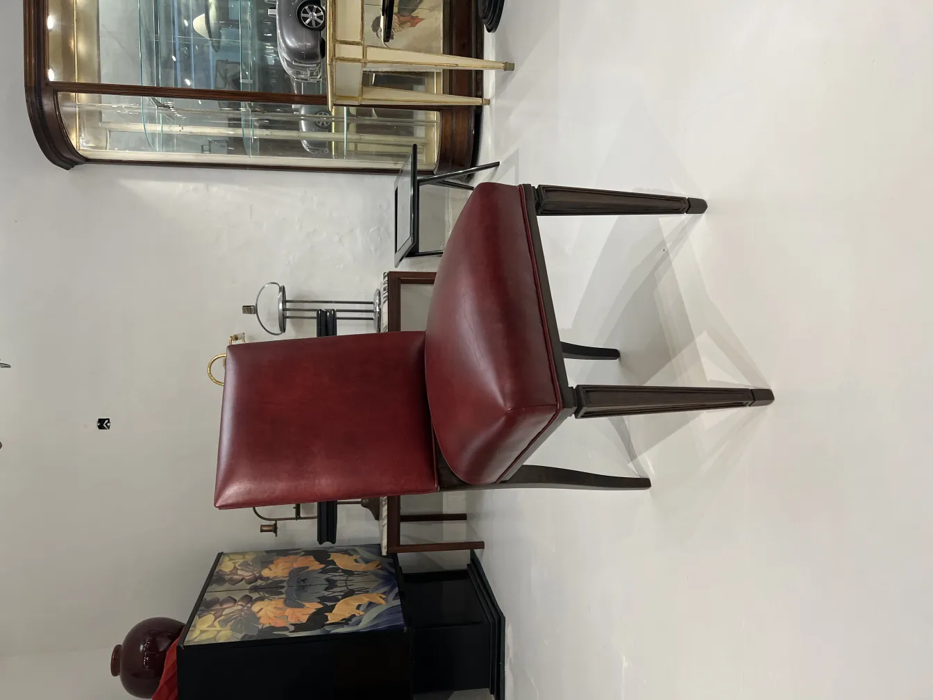 Side view of 12 antique chairs in an elegant setting