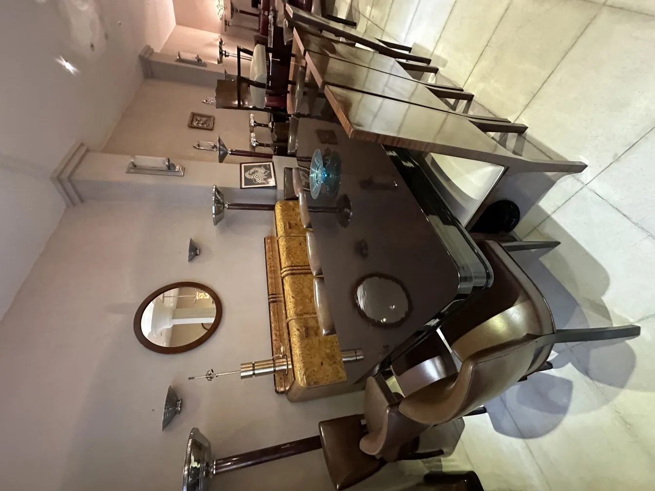 View of 12 antique chairs in an elegant setting