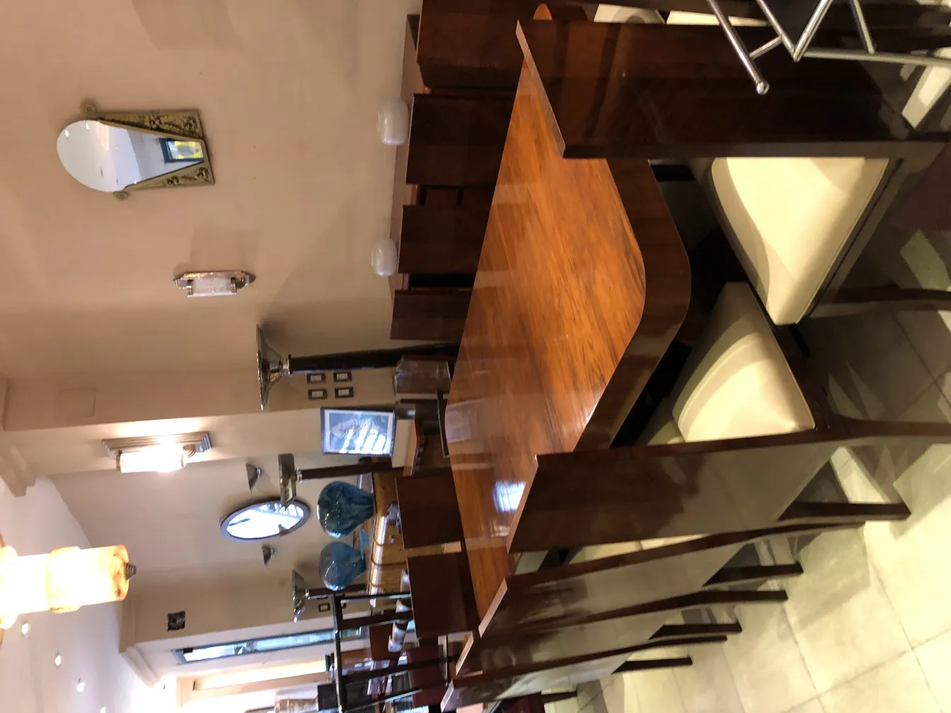 12 antique chairs in an elegant setting with table