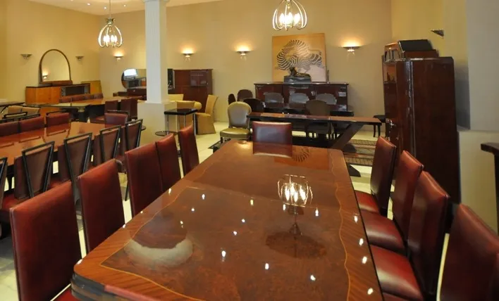 View of 12 antique chairs in an elegant dining room
