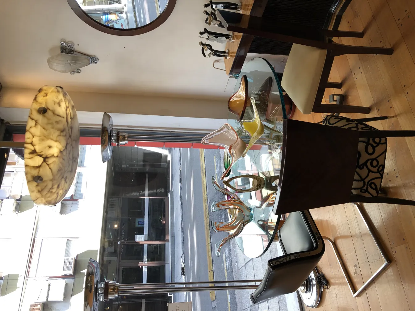 12 antique chairs in a cozy setting with decorative details.