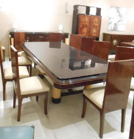 12 antique chairs with light upholstery in the dining room