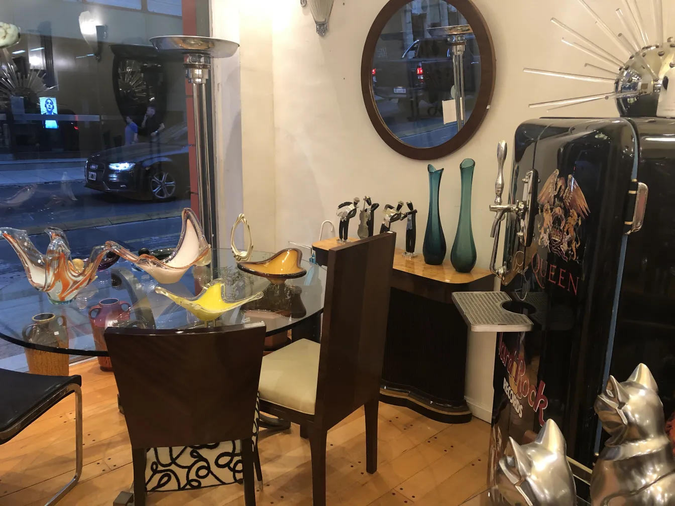 View of several antique decorative chairs in a cozy setting