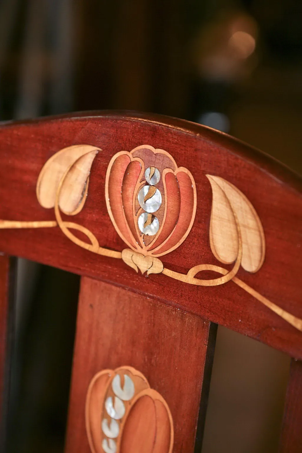 antique chair with decorative detail on the backrest, cozy ambiance.