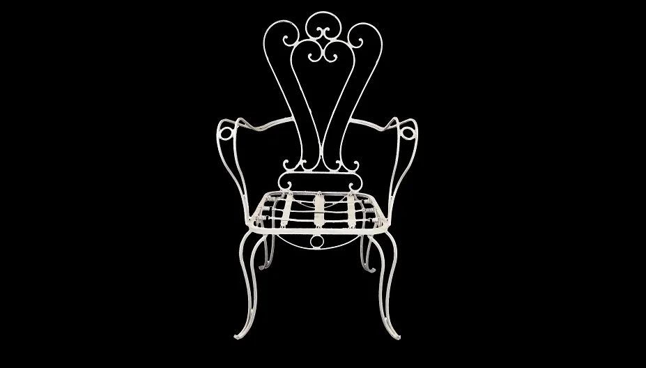 Antique garden armchair with elegant curves and stylized design