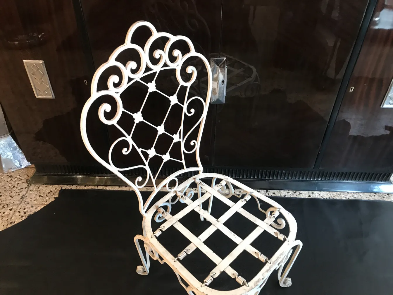 2 antique garden chairs with decorative backrest design