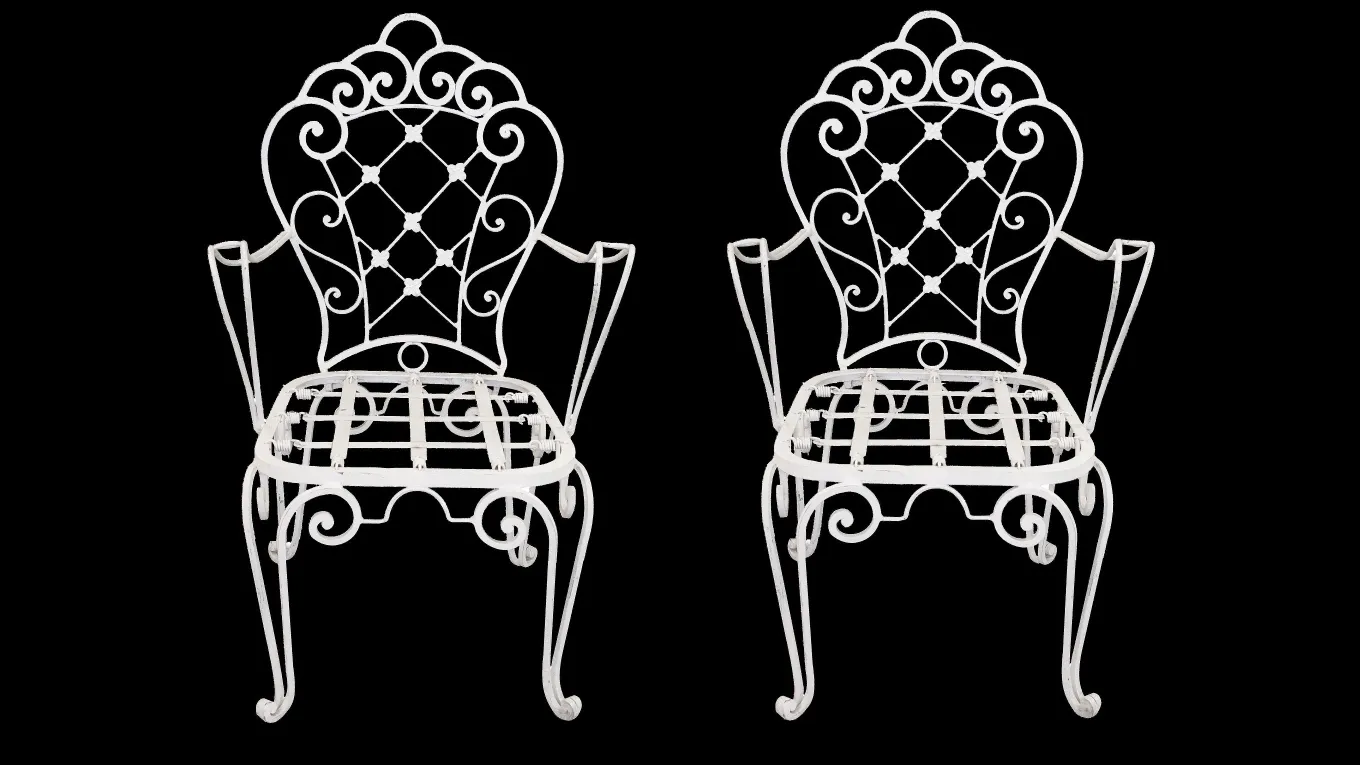 Dos sillones de jardín antiguos con diseño decorativo, en un ambiente acogedor