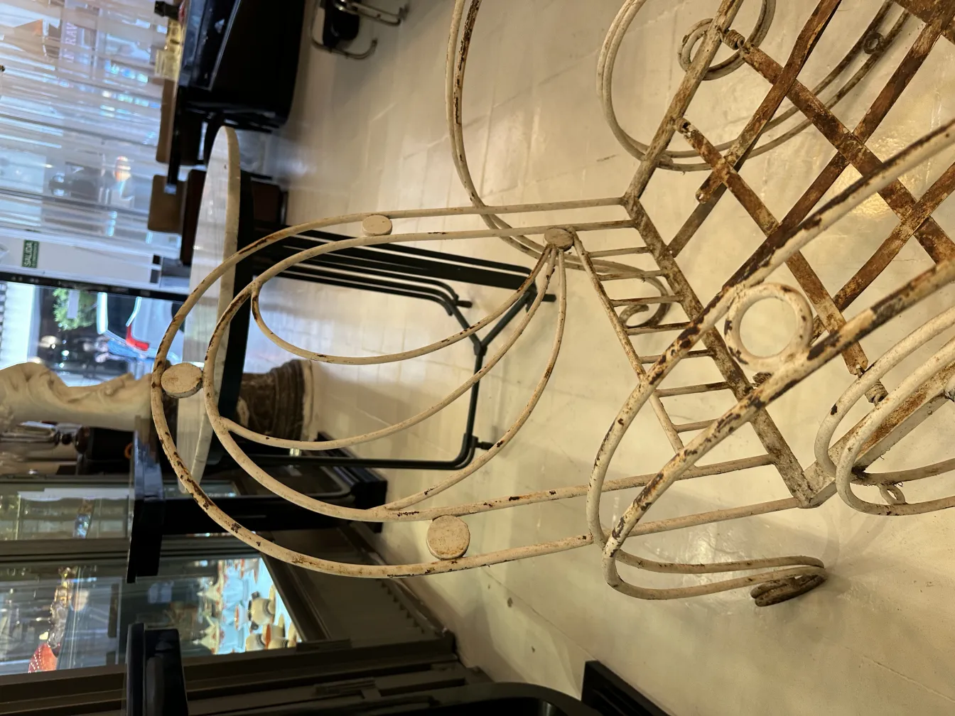 3 antique garden armchairs, featuring decorative details in an elegant setting