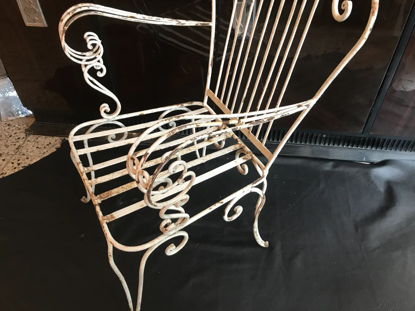 Antique garden armchairs with ornaments, in a casual setting