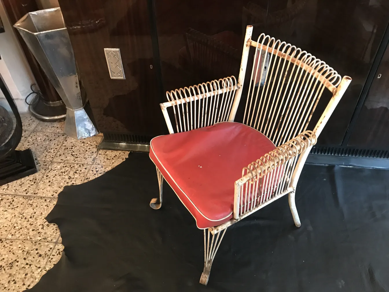 Four antique garden armchairs in a decorative setting