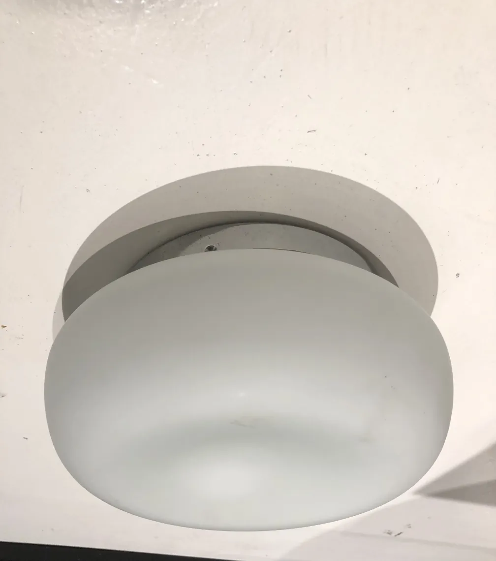 rounded ceiling light in white room