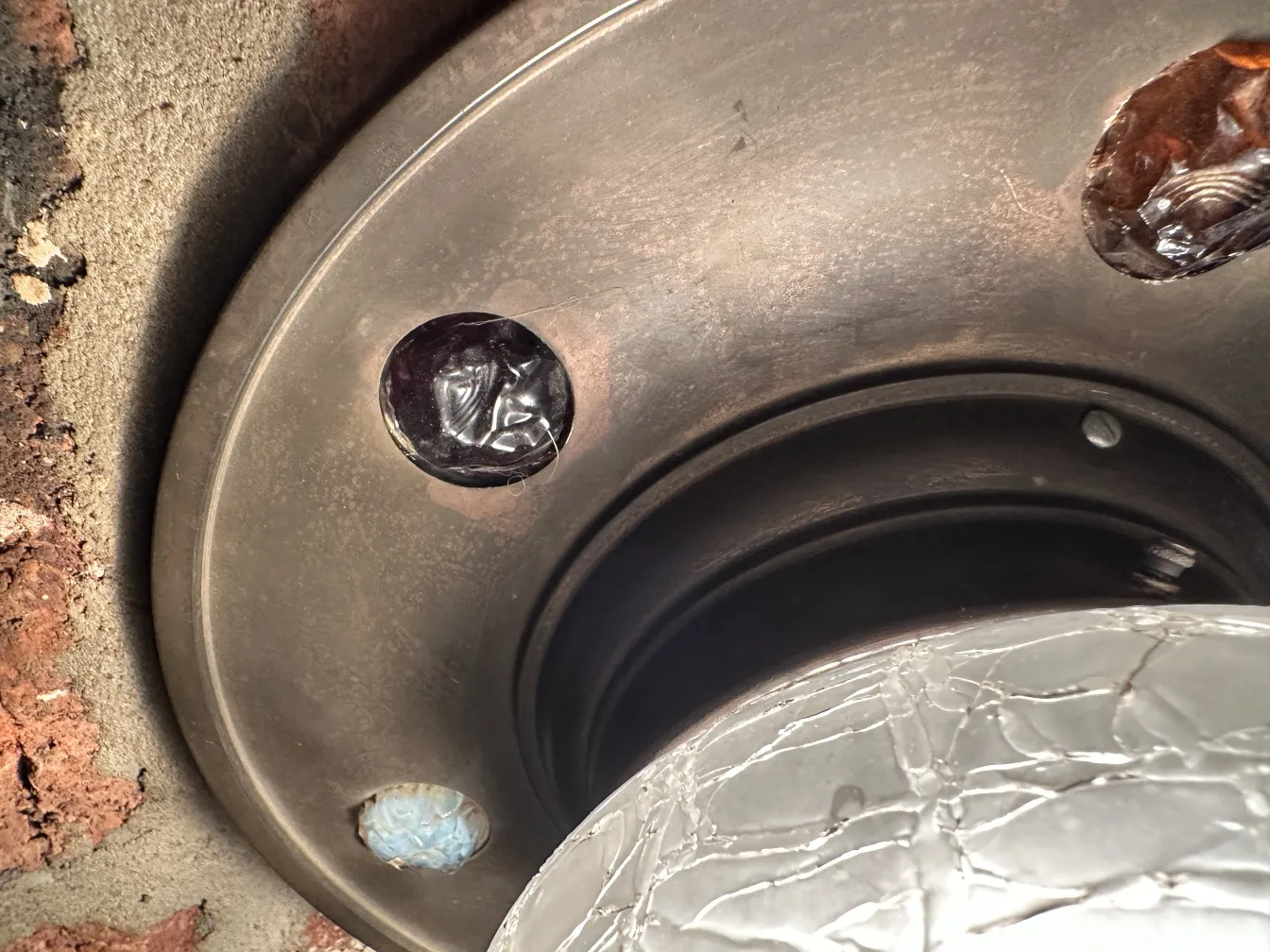 antique ceiling light with decorative details in a rustic setting