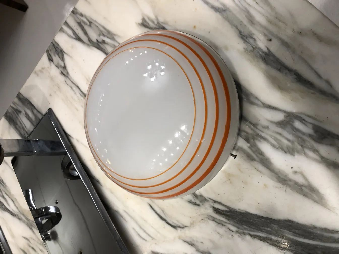 Three antique ceiling lights with orange stripes on white background