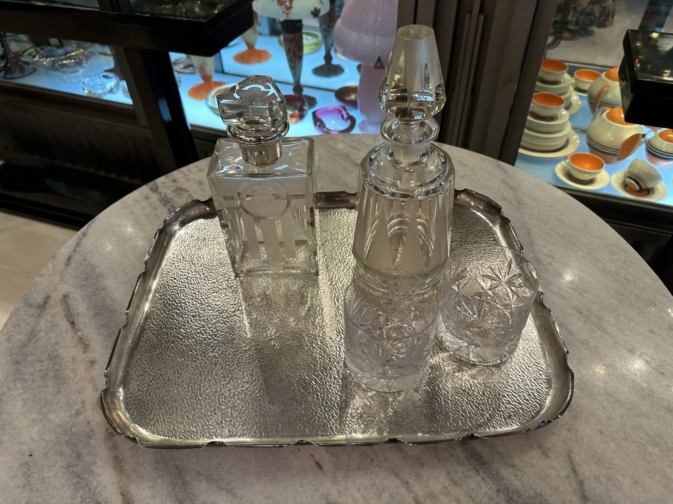antique metal tray with glass bottles