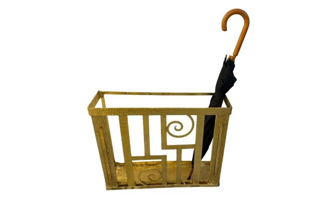 Antique umbrella stand with gold design and black umbrella