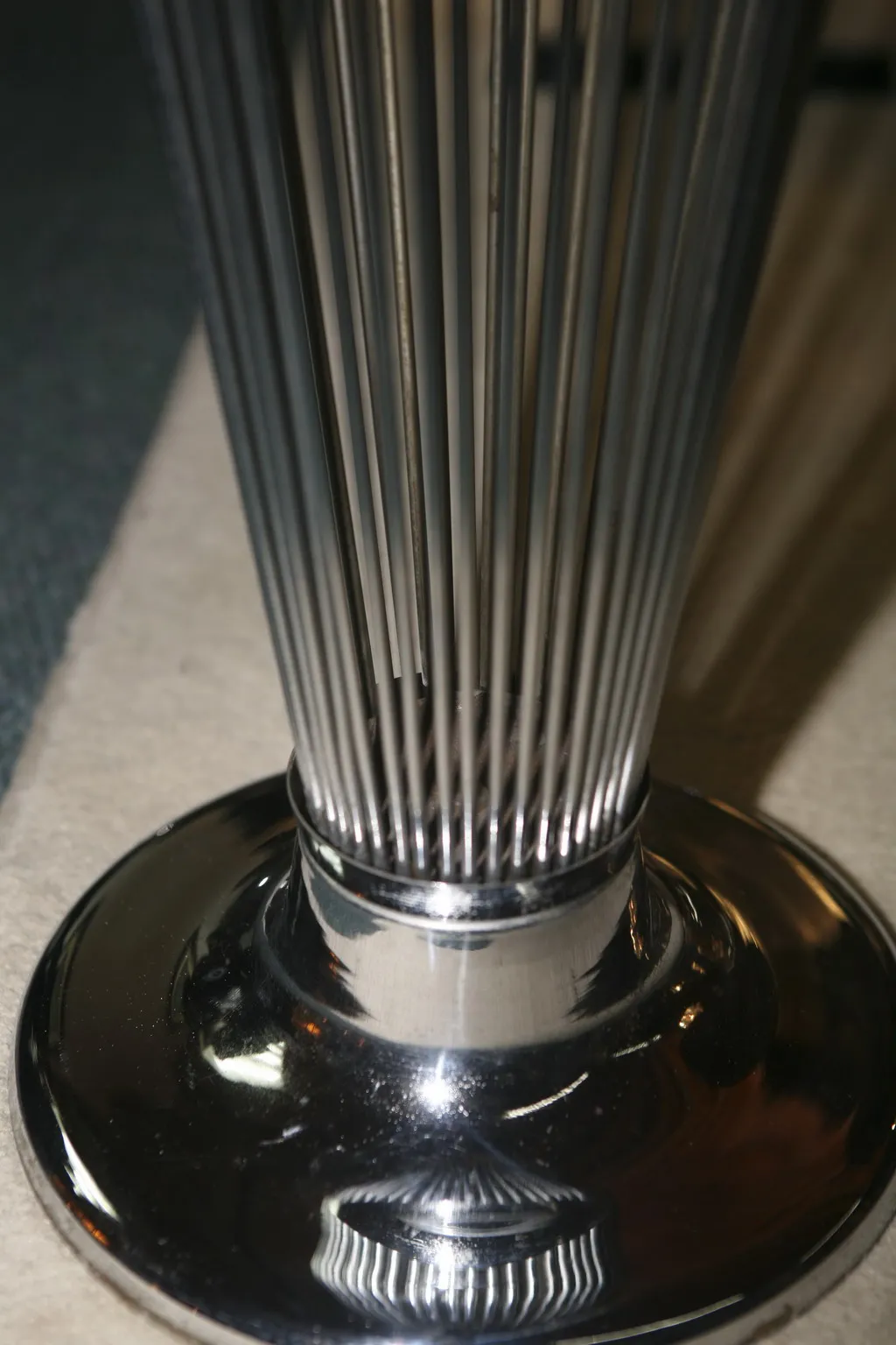 Antique umbrella stand with a stylish design, in a cozy setting.