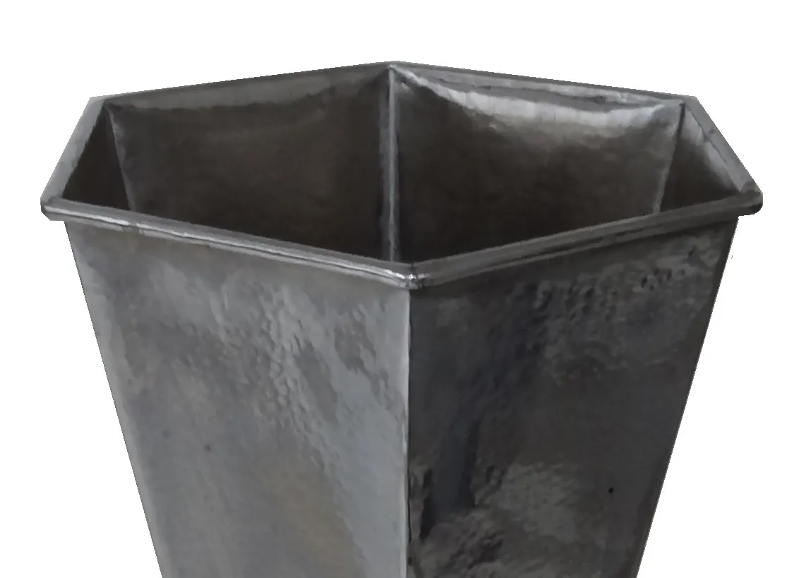 Antique hexagonal umbrella stand in dark color.